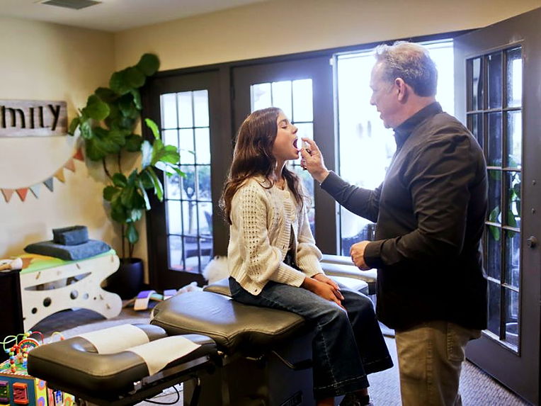 Dr. Gundelach with a patient in the treatment room